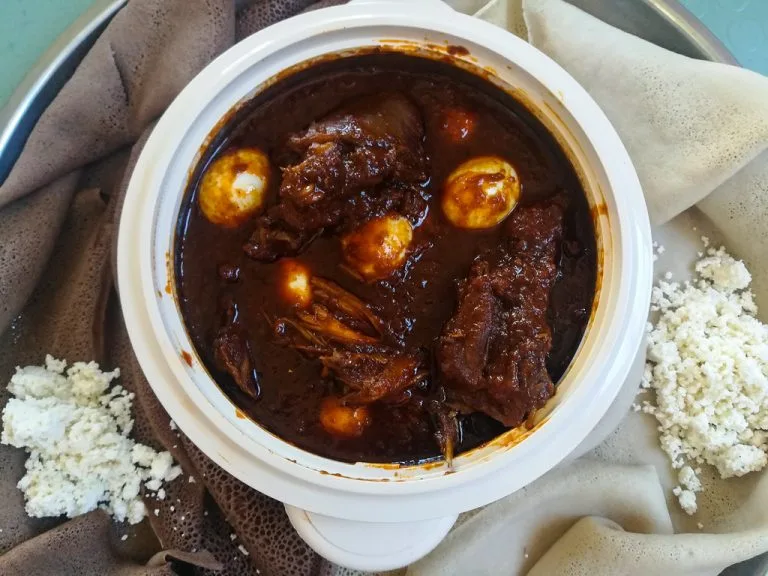 Traditional injera with Ethiopian stews and wots at Merkato Restaurant Winnipeg